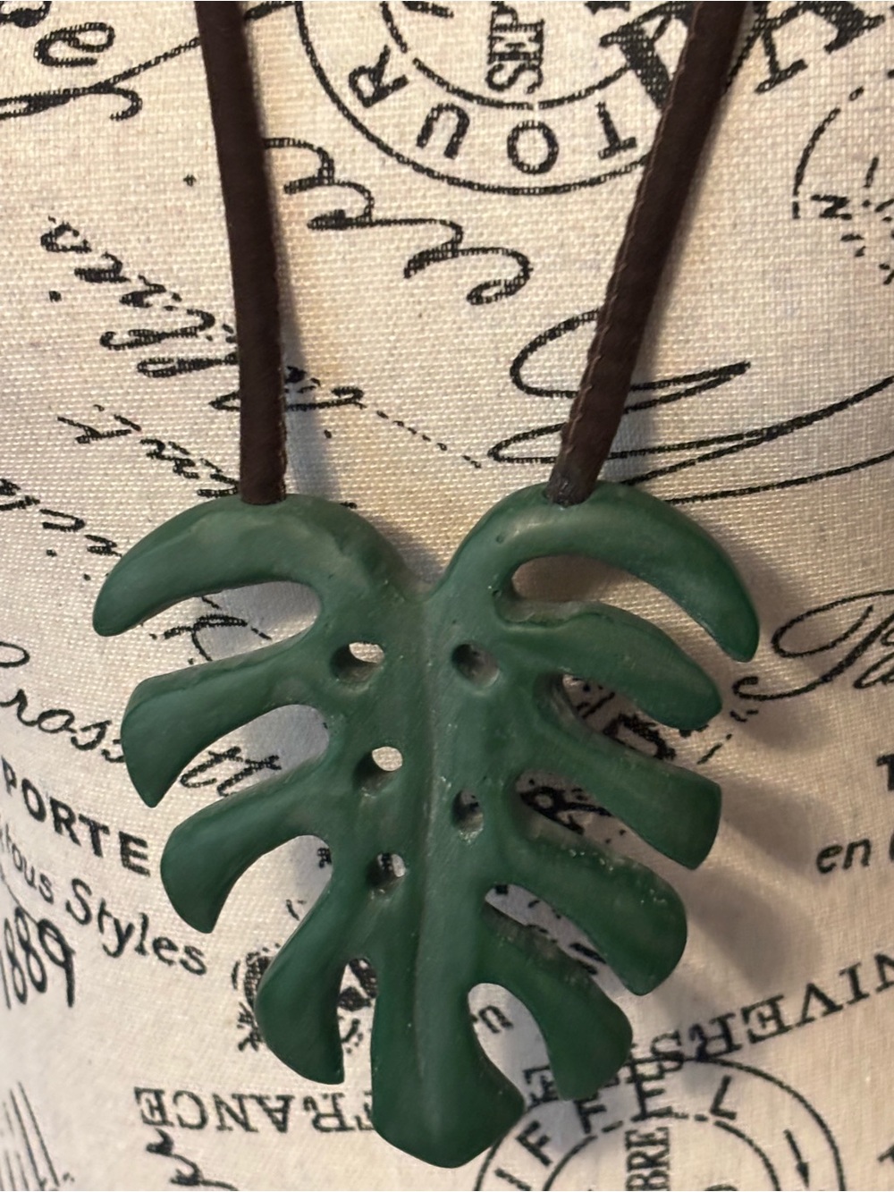 Green Carved Leaf Pendant on Brown Cord Necklace